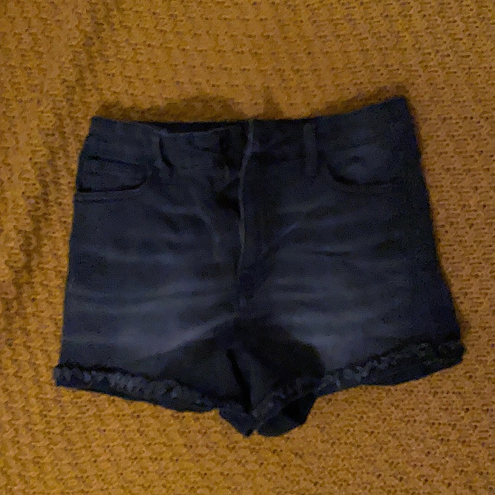 New and never worn. Short, back jean shorts with a folded raw hem.